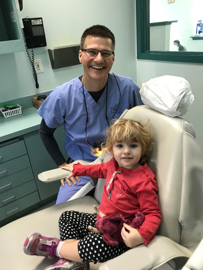 Dr. Elise in the office with a patient.